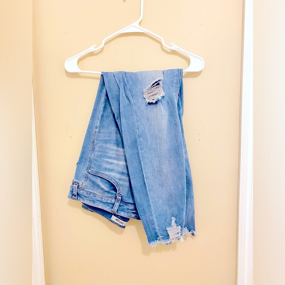 Denim - Distressed Denim in the knees and ankles.